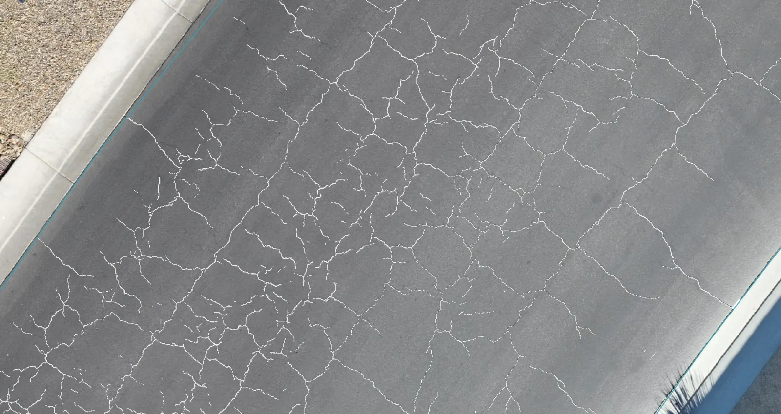 HALO AI crack tracing drawn over every crack on a drone orthomosaic of a road