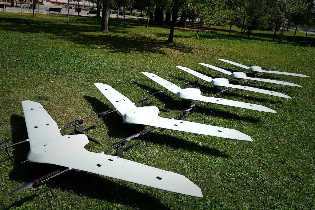 Six white production Nimbus aircraft lined up on the grass