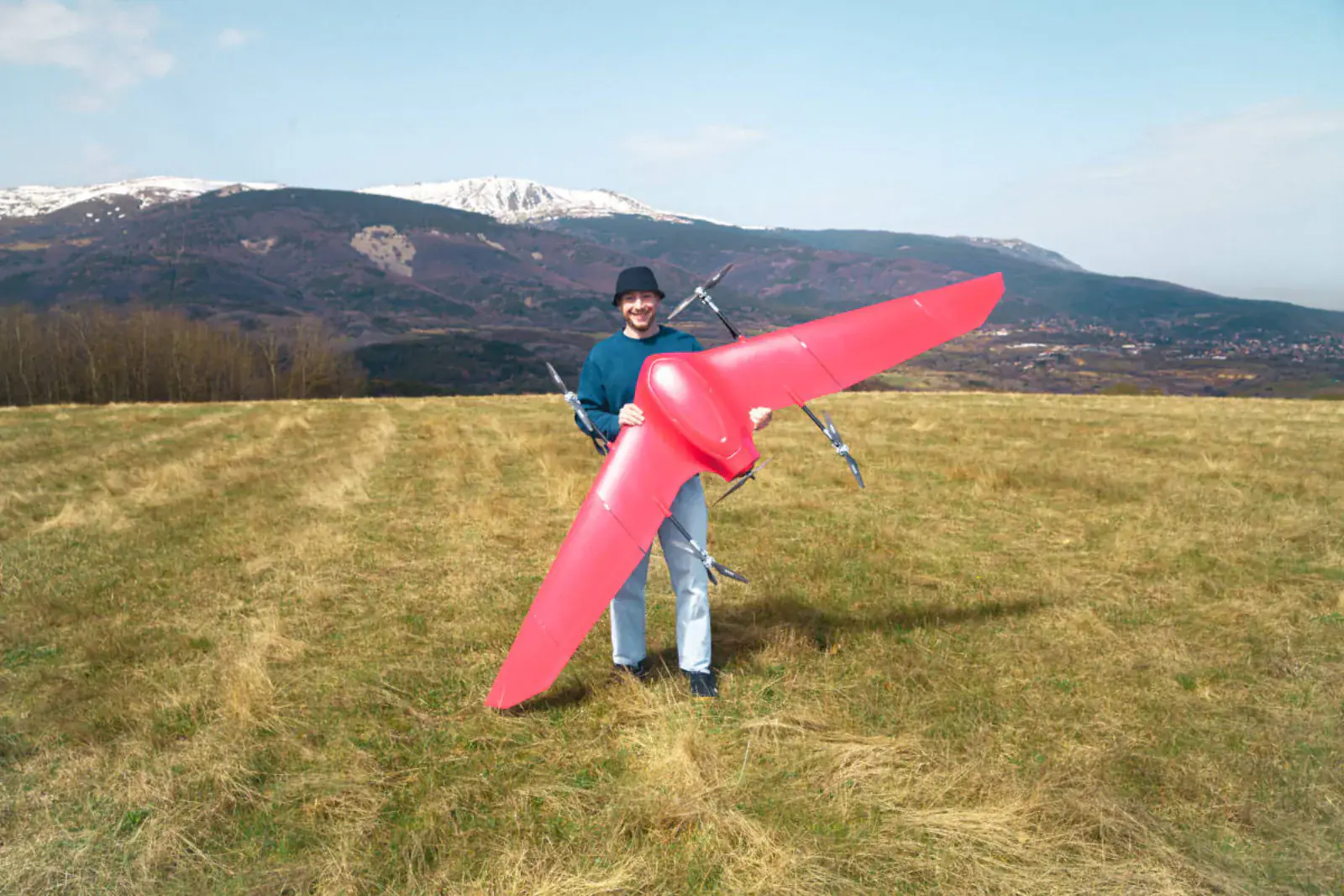 One person holding a full-size Nimbus in a mountain meadow